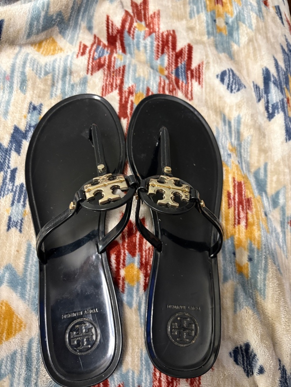 Tory Burch Black Thong Sandals with Gold Logo Medallion
